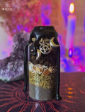 Curse Breaker Spell Jar for Baneful Energy Cleansing with black wax, black salt, egg shell, black pepper, herbs, and a pentagram charm.