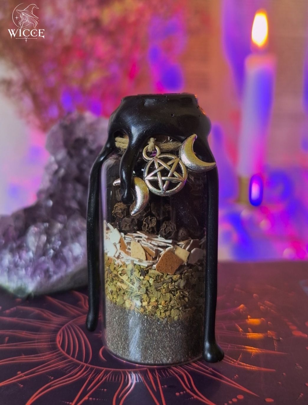 Curse Breaker Spell Jar for Baneful Energy Cleansing with black wax, black salt, egg shell, black pepper, herbs, and a pentagram charm.