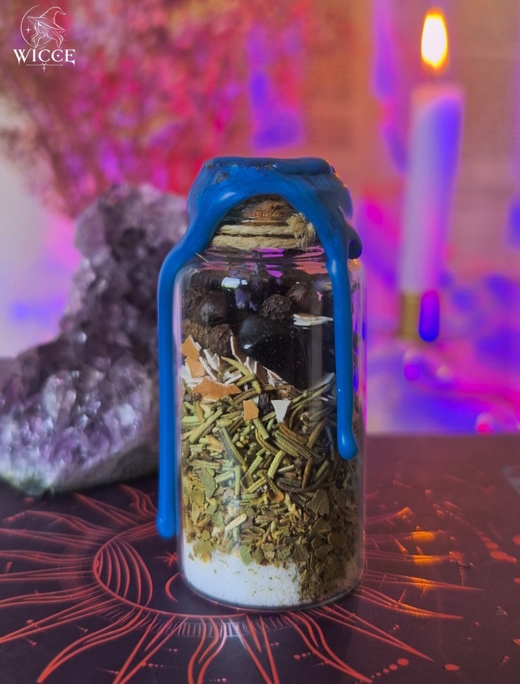 Evil Eye Shield Spell Jar for Warding Off Envy, Jealousy & Malice viewed from the back, featuring black opsidian, egg shell, dried herbs and protective ingredients