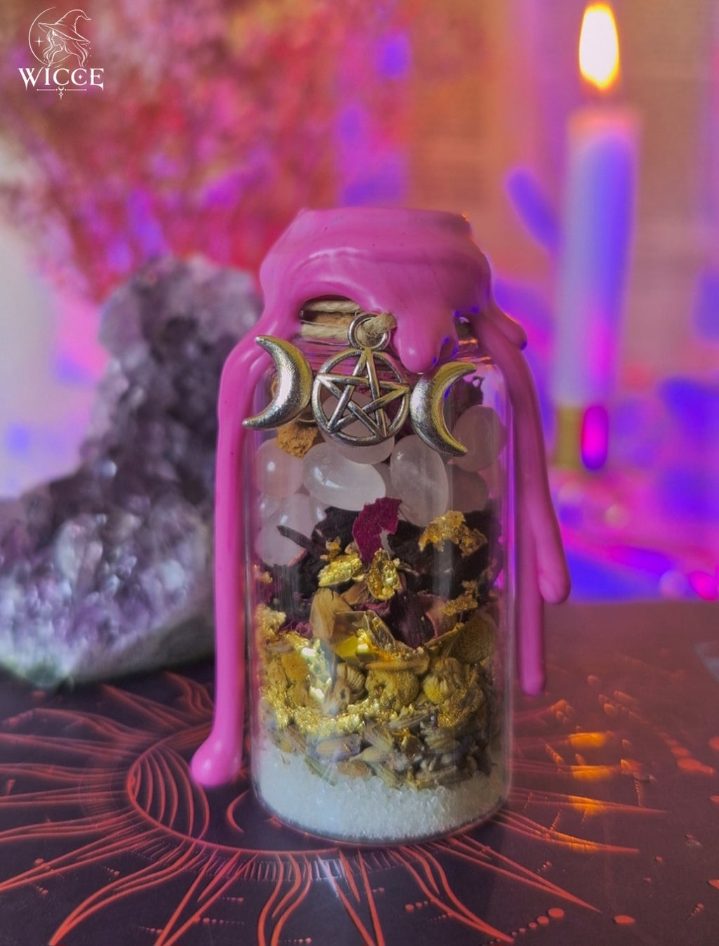 Glamour Spell Jar for Magnetic Energy & Charisma with pink wax, rose quartz, chamomile, lavander, and a pentagram charm.