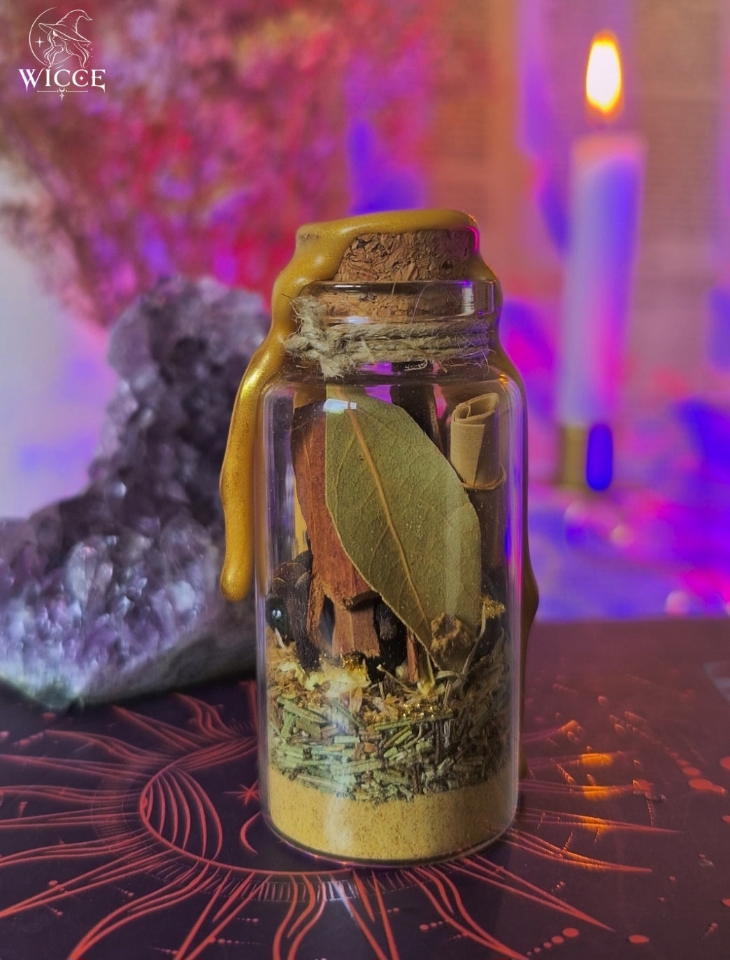Goal Manifestation Spell Jar for Ambition & Success viewed from the back, featuring bay leaves, cinnamon, clove, dried herbs and a rolled intention scroll.