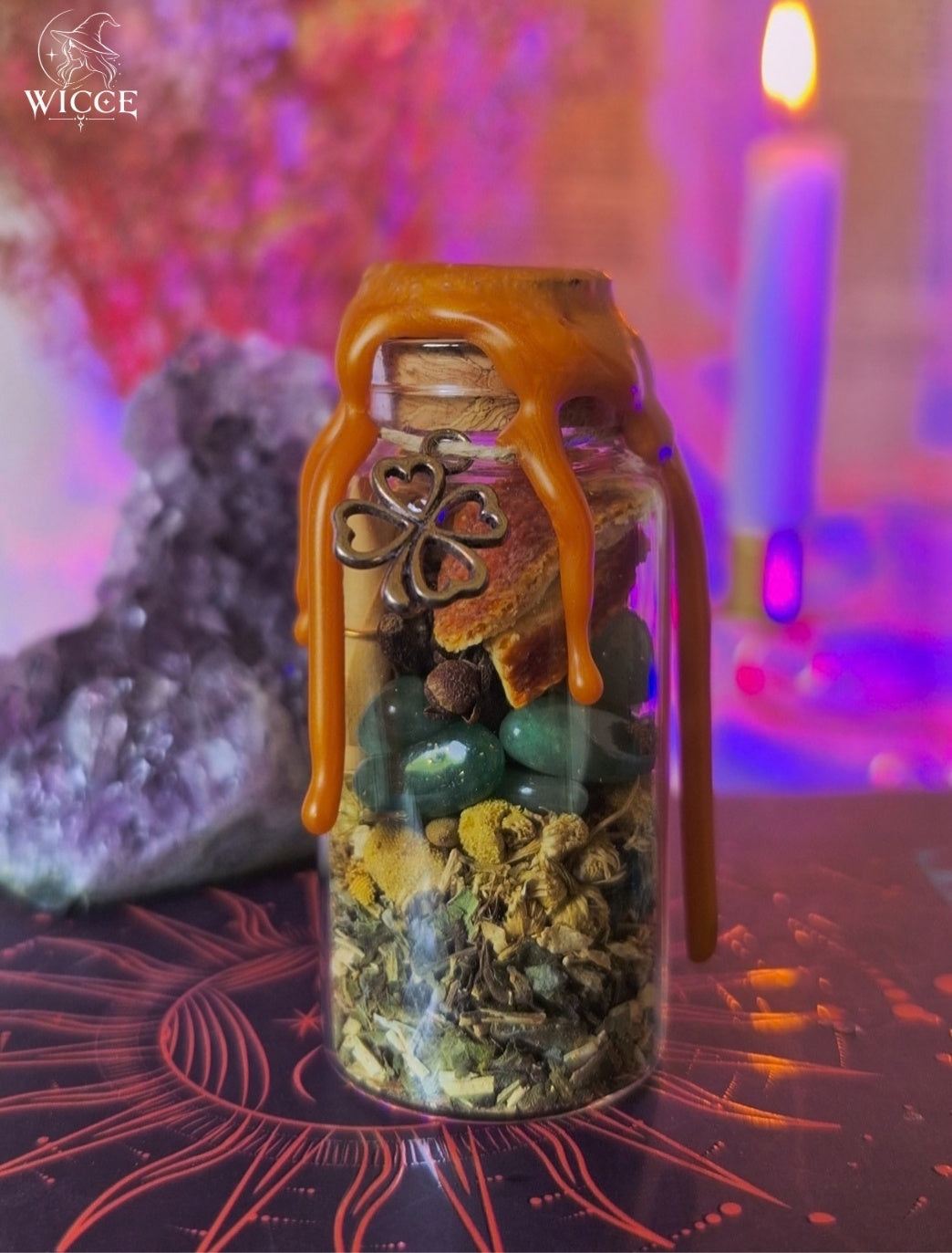 Good Luck & Fortune Spell Jar for Abundance & Opportunities with orange wax, green aventurine, orange peel, chamomile, herbs and a clover charm.