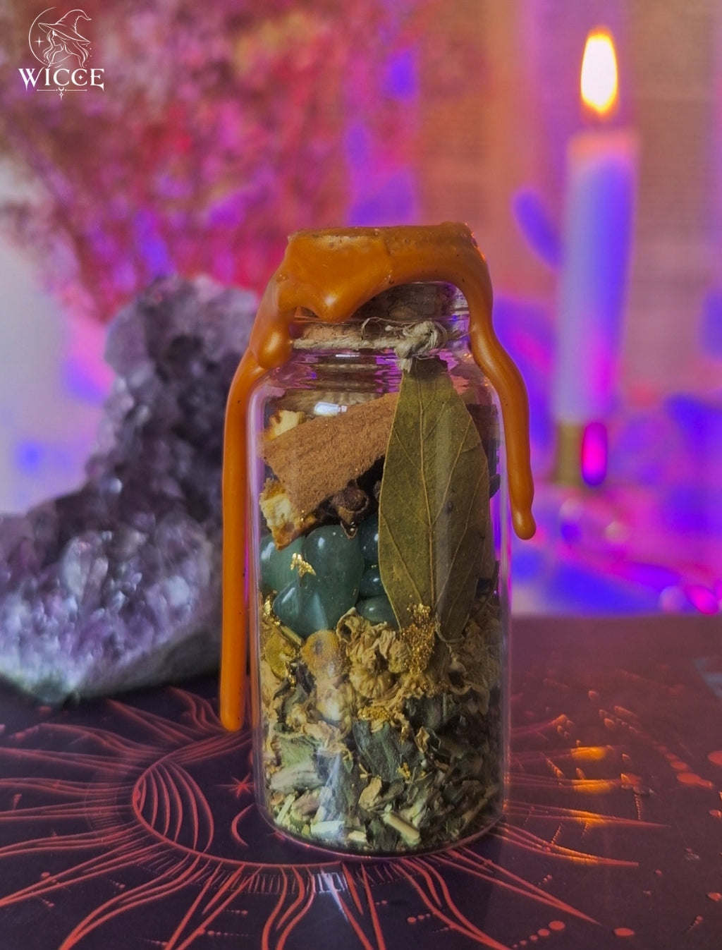 Good Luck & Fortune Spell Jar for Abundance & Opportunities viewed from the back, featuring green aventurine, orange peel, bay leaf, cinnamon, dried herbs and luck-attracting ingredients.