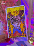 Soulmate Partner Tarot Reading  Everything about them with "The Lovers" Tarot Card held by a hand.