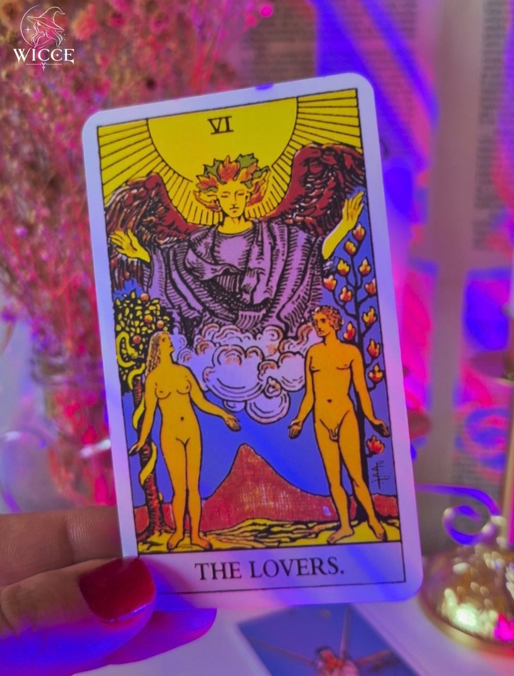 Soulmate Partner Tarot Reading  Everything about them with "The Lovers" Tarot Card held by a hand.